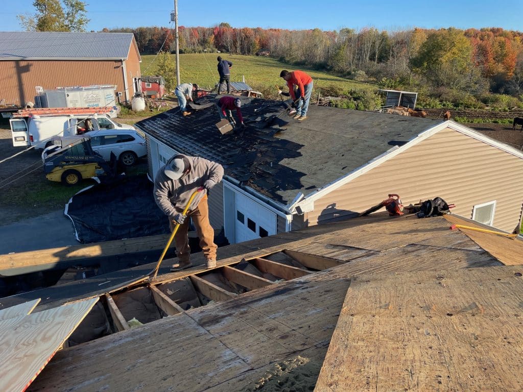 Commonwealth Maintenance team installing new shingle roofing on residential home near Clarks Summit, PA 18411