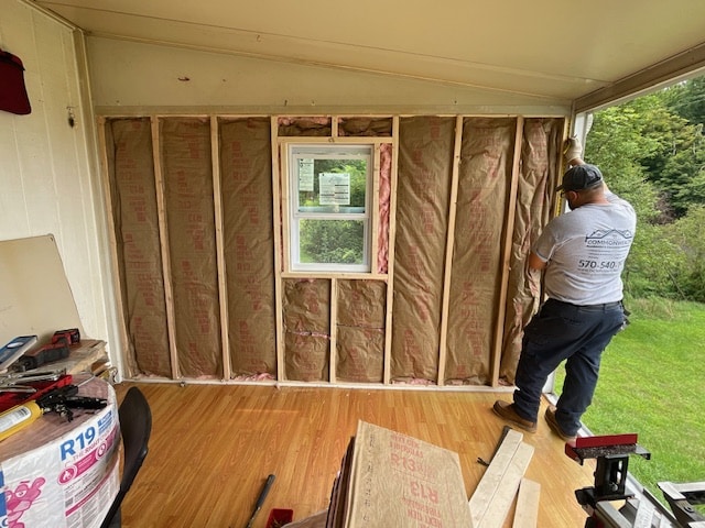 Commonwealth Maintenance team standing near enclosed porch construction in Springville, PA, showcasing their residential project
