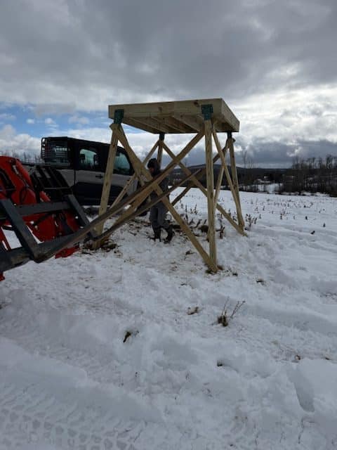 Close-up of the sturdy, custom-built deer stand showcasing Commonwealth Maintenance's craftsmanship and attention to detail