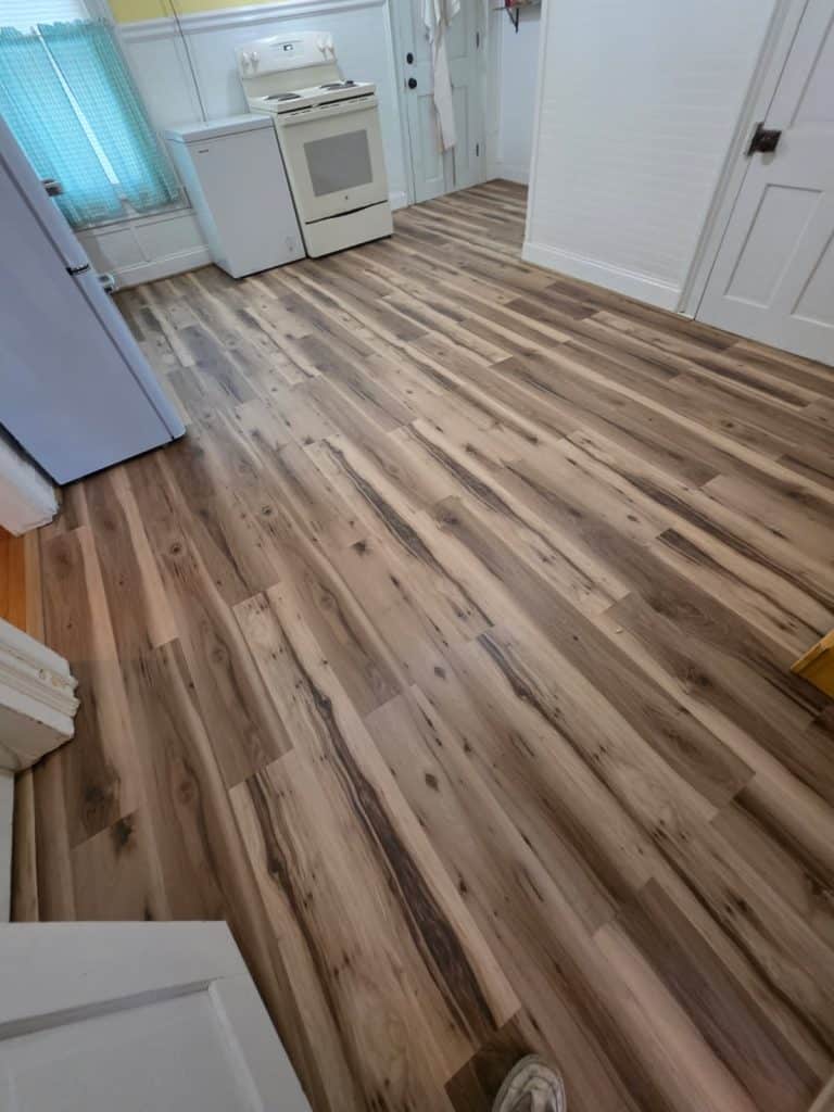 Before and after comparison of a residential flooring replacement project completed by Commonwealth Maintenance in Susquehanna, PA 18847